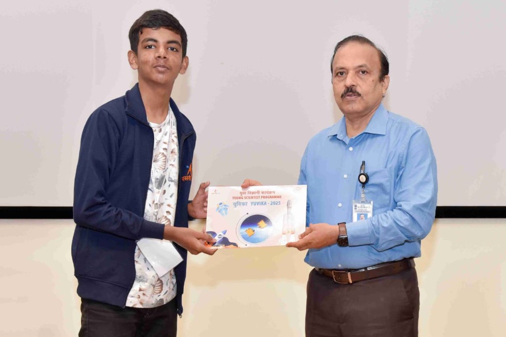 Avanish receiving a certificate of recognition